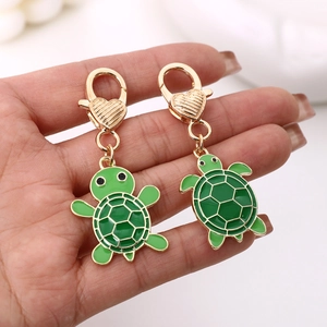 Lot de porte-clés tortue en métal vert avec motif alvéolé doré pour sacs à main