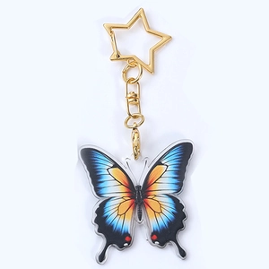 Porte-clés papillon en acrylique bleu et orange avec fermoir étoile doré pour sacs