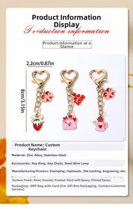 Detailed view of Valentine heart keychains with strawberry and envelope charms in pink