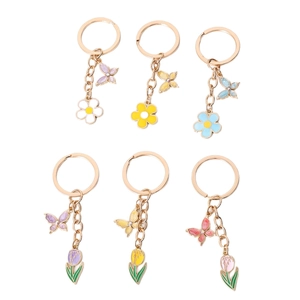 Floral butterfly keychain set with daisy and tulip charms in pastel macaron colors