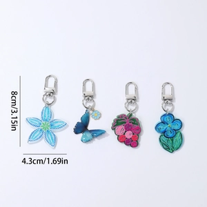 Acrylic flower and butterfly keychain set with dimensions 8cm by 4.3cm in blue tones