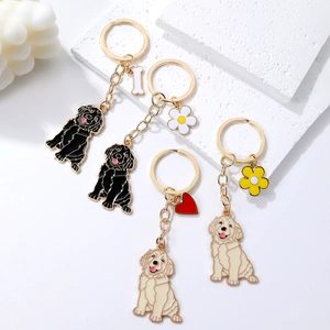 Cute enamel dog keychains in golden metal finish with floral and bone charms for pet lovers