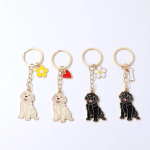 Set of four cartoon golden retriever metal keychains with flower and bone charms