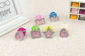 Mini photo frame pendants with rhinestones in heart, star, and bone shapes with lobster clasp
