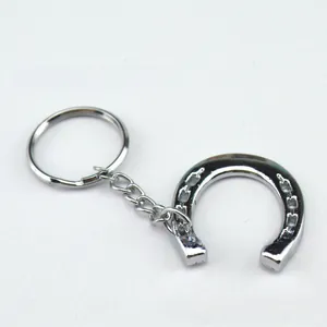 Polished silver horseshoe keychain with lucky horseshoe pendant and flat metal ring