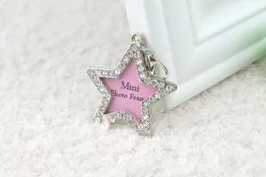 Star-shaped silver pet tag with sparkling rhinestones and pink center photo insert
