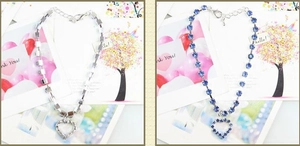 Detail of heart pendant pet necklaces with silver rhinestones and blue crystals