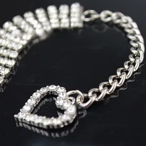 Detail of silver-tone mixed chain pet necklace featuring a large rhinestone heart pendant