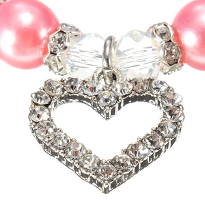 Detailed view of an open heart pendant with rhinestones and pink pearls for pets