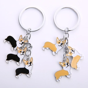 Creative Corgi metal keychain set featuring cartoon dog charms in black and gold finishes