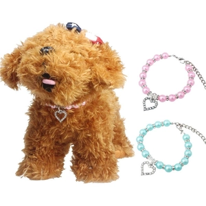 Detailed view of colorful pet pearl collars with sparkling heart-shaped crystal pendants