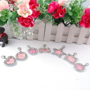 Detailed view of silver rhinestone pet photo frame charms in various cute shapes