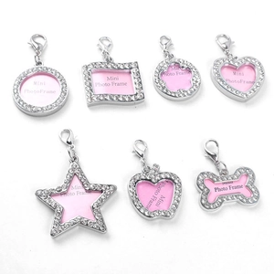 Set of seven silver rhinestone mini photo frame pendants in various shapes with lobster clasps
