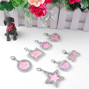 Detail showing various mini photo frame charms with rhinestones and lobster clasps