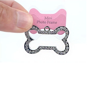 Close-up of bone-shaped sparkling rhinestone pendant with mini photo frame for pets