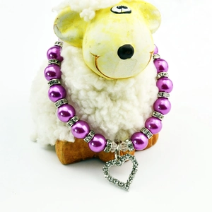 Close-up of purple pearl pet necklace with a hollow heart diamond-encrusted pendant