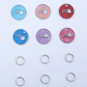 Detailed set of 6 fishbone pattern pet ID tags in glittery colors on white background