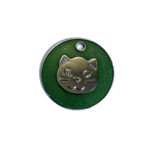 Detailed close-up of emerald green enamel cat pendant with golden metallic relief