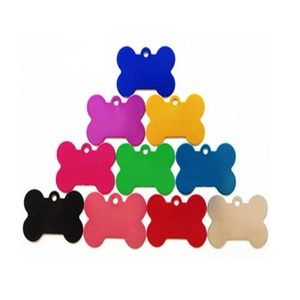Detailed view of ten bone-shaped colorful aluminum pet tags stacked on a white background