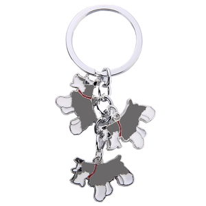 Detailed view of silver metal keychain with three grey Schnauzer dog alloy charms