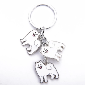 Cute Samoyed dog breed metal keychain with three white enamel charms and a silver ring