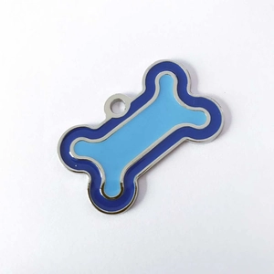 Detail of blue enamel bone-shaped pet ID tag with durable zinc alloy frame and ring