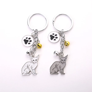 Creative Sphynx cat metal keychains in grey and white with bells and paw charms