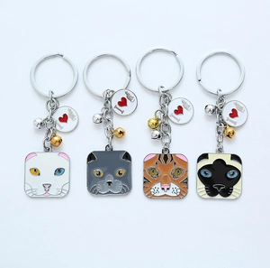 Set of four colorful enamel cat head keychains with bells and I Love Cat charms