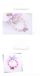 Detail of pink and white faux pearl pet collar with ribbon bow and bone pendant