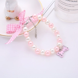 Pink pearl pet collar with plaid bow and rhinestone bone pendant for dogs