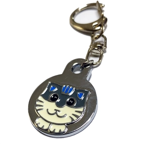 Detail view of cartoon cat shaped metal pet ID tag with colorful enamel finish and silver clasp