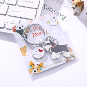 Detailed view of Schnauzer dog keychain with heart charm and 'I love dogs' metal plate