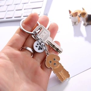 Cartoon Poodle Keychain with brown enamel charm and black and white paw print pendant