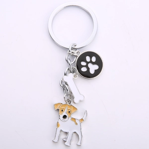 Detail of Jack Russell dog keychain with enamel bone and paw print charms in silver finish