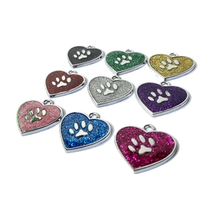 Glittery heart-shaped pet ID tags with paw prints in various vibrant colors