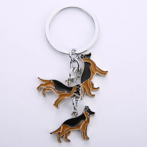 Detailed view of German Shepherd metal keychain with enamel charms in black and brown finish
