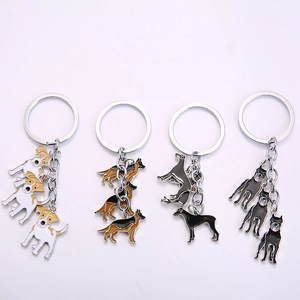 Set of metal dog keychains featuring Jack Russell, Shepherd, Great Dane and Doberman breeds