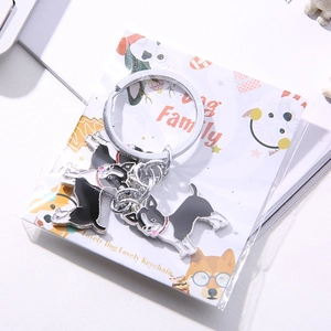 Creative metal Chihuahua keychain set with black and white enamel dog charms in gift packaging