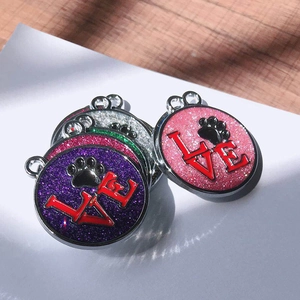 Glittering pet ID tag with LOVE text and paw print in various colorful metal frames