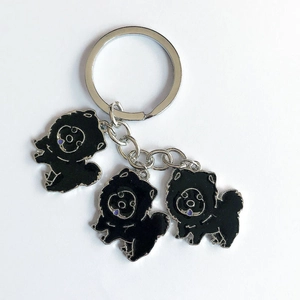 Creative black Chow Chow metal enamel keychain with three cute dog charms on a silver ring