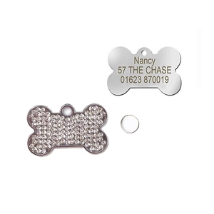 Detail of bone-shaped pet ID tags with sparkling rhinestones and custom laser engraving