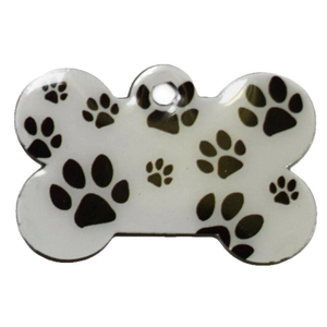 Bone-shaped pet ID tag with black paw print pattern and pre-drilled hanging hole