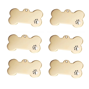 Pack of 6 gold bone-shaped stainless steel pet ID tags with paw print cutout design