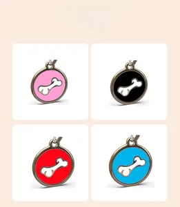 Selection of round stainless steel pet ID tags in pink, black, red and blue with bone icon