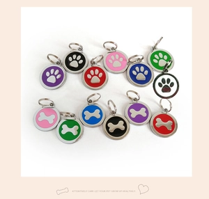 Collection of colorful zinc alloy dog ID tags featuring paw and bone prints with split rings