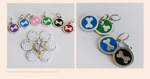 Detail view of double-sided zinc alloy pet ID tags with colorful enamel bone patterns