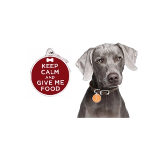 Detail of round pet ID tags with bone icons and Keep Calm text on a dog collar