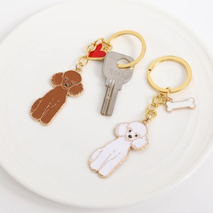 Schattige teddyhond sleutelhangers van emaille in bruin en wit met hartje en bot