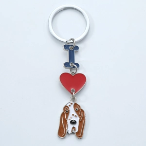 Detailed close-up of metal enamel keychain with red heart and cute dog pendant