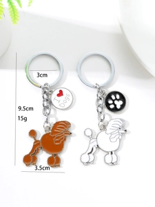 Detailed view of poodle keychains in brown and white with I Heart Dogs charms